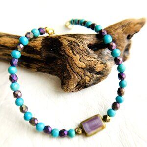 Turquoise gemstone with fire polish purple beads and a Czech rectangle focal